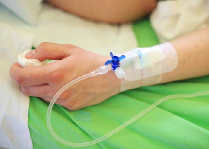 44571152 Patient Hand With Infusion On Hospital Bed