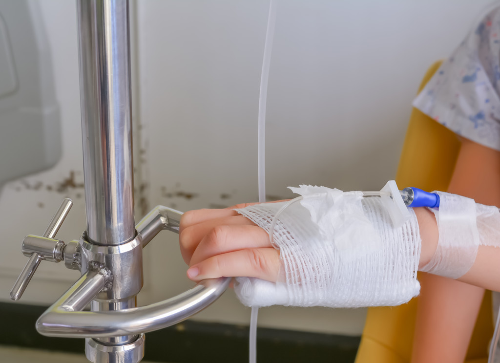 Child's Hand Who Fever Patients Have IV Tube.